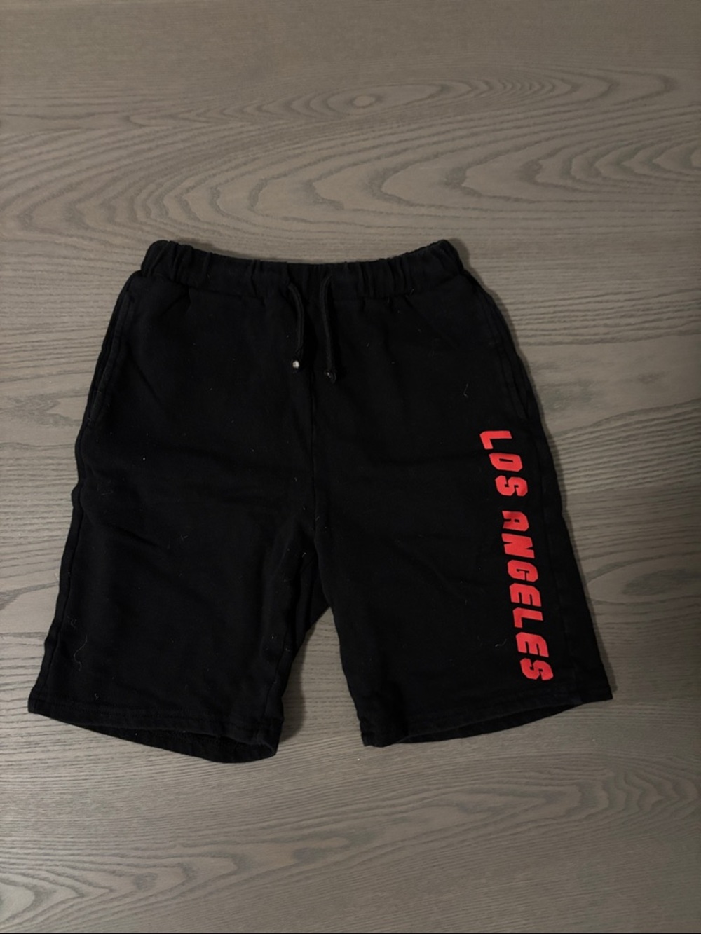 Kids Black 'Los Angeles' Graphic Shorts damage on drawstring